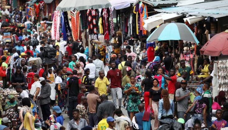 Shoppers crowd a market in Nigeria’s commercial capital of Lagos